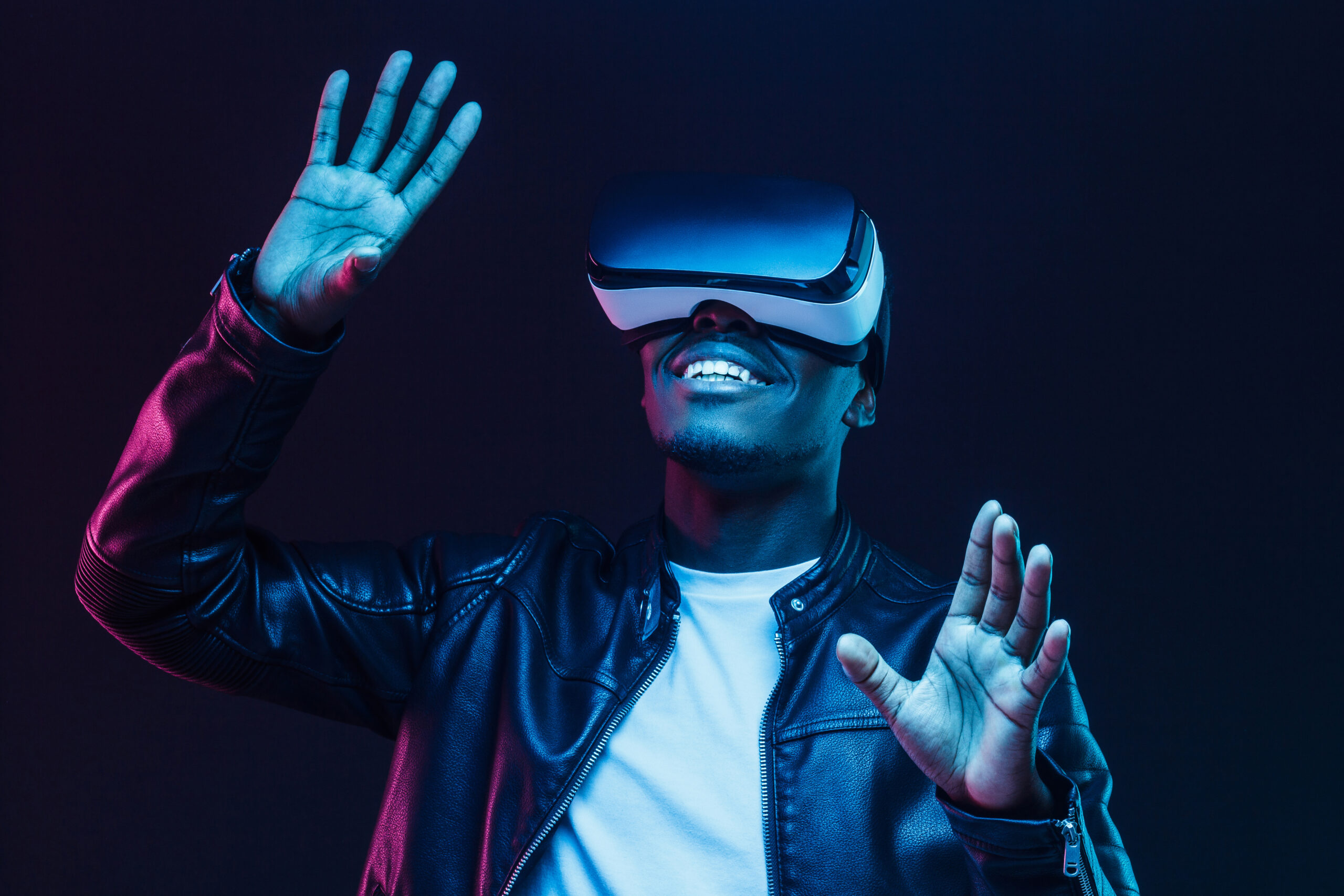 Young man using virtual reality goggles at a trade show